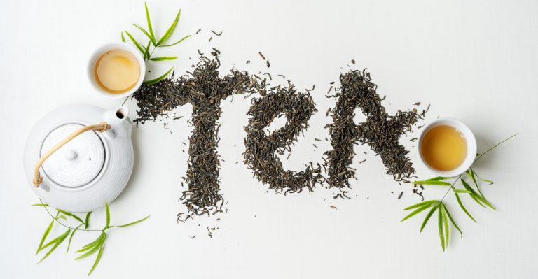 Composition tea set with lettering TEA