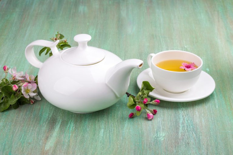 The Four Grades of Fujian White Tea White tea, white cup, saucer white, and apple blossoms