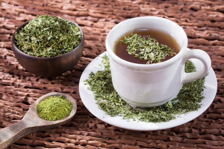 Moringa tea with powder and leaves