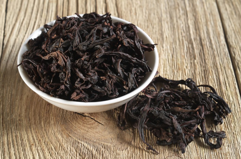 da hong pao oolong tea in a bowl on wooden background