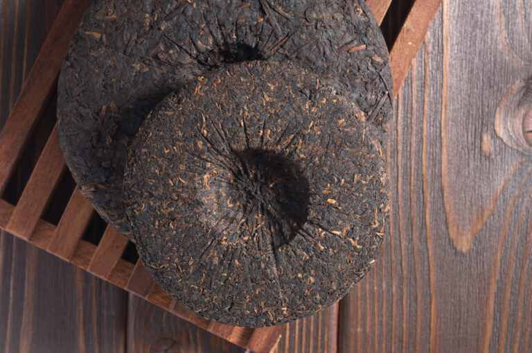 chinese pu'er tea on wooden tray and table