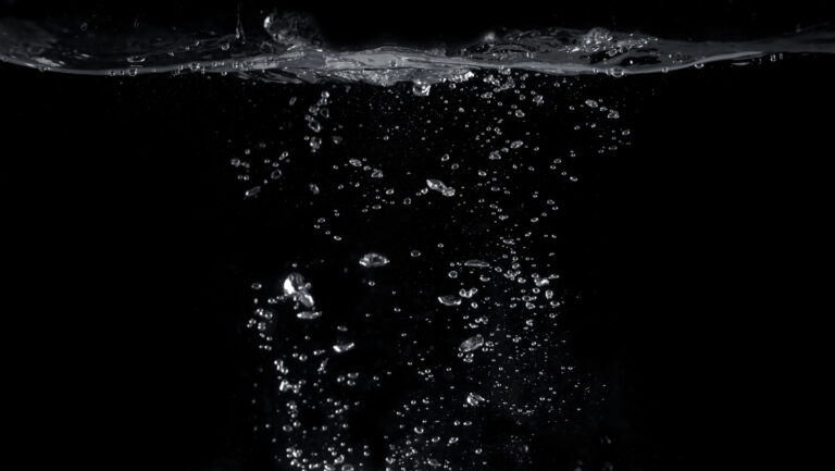 soda water bubbles fizzing upwards